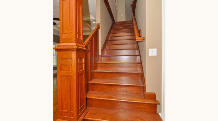 ICH Builders Mt. Sterling residence custom build looking up main wooden stairs to the second floor